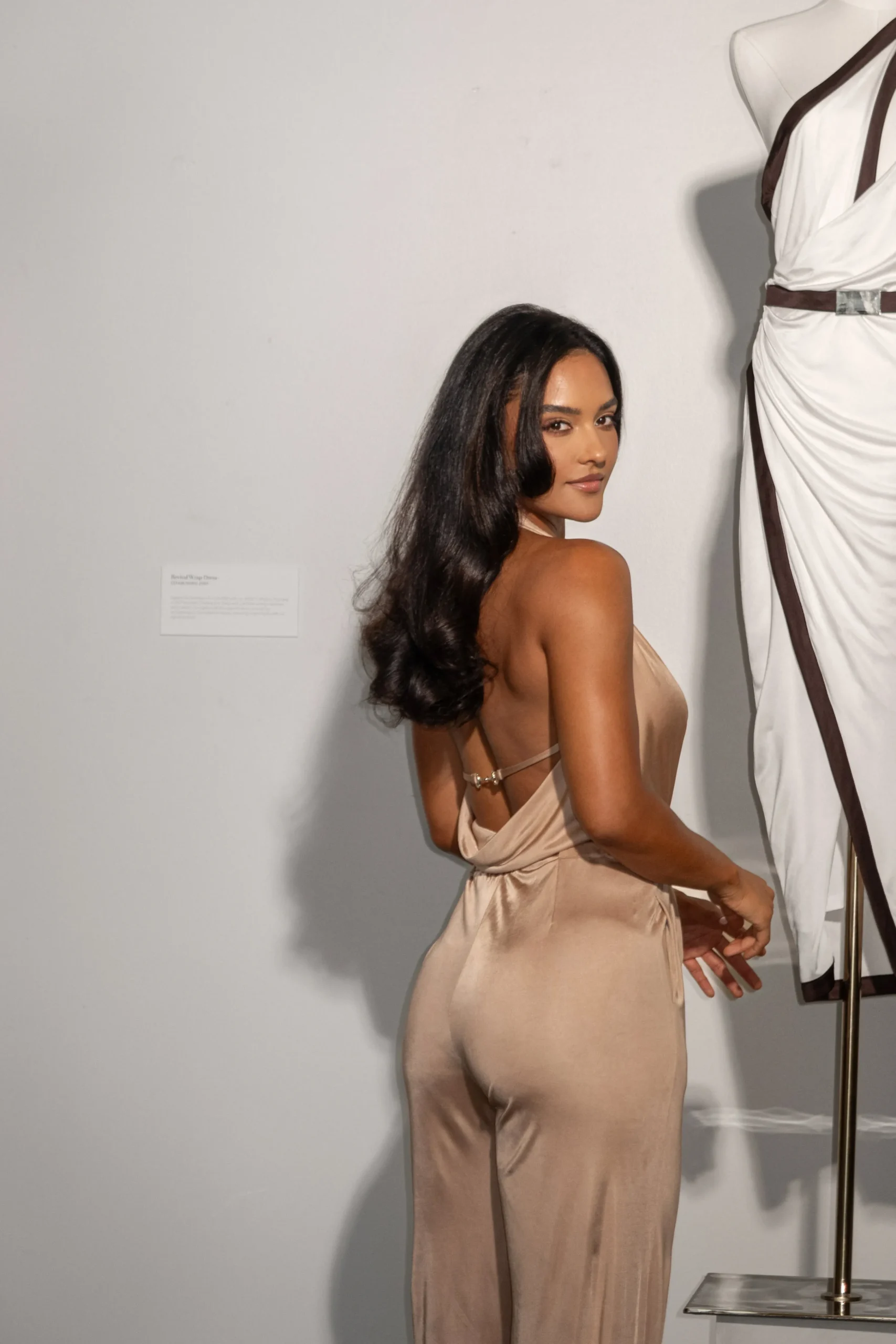 beige_slinky_halter_belte_0.webp JLUXLABEL Beige Slinky Halter Belted Jumpsuit
